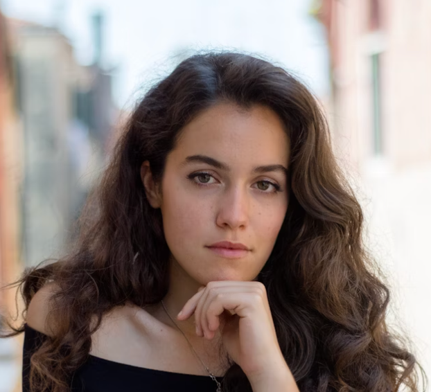 Dark haired woman street portrait